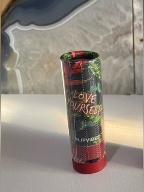 Almay Lipstick Tube in Red and Black Tropical Design